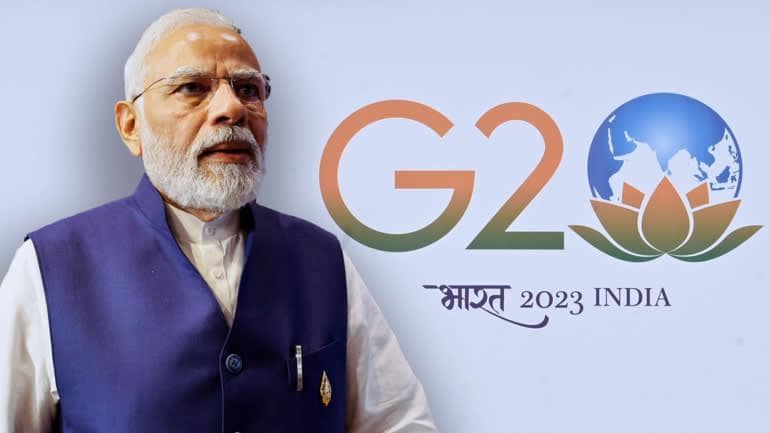 Thủ tướng Narendra Modi và biểu tượng G20 mới của Ấn Độ.