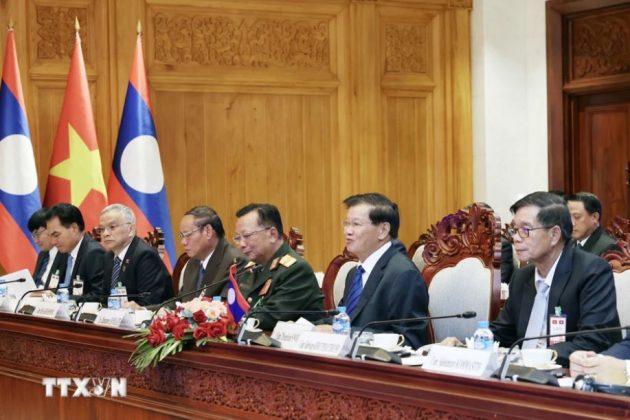 Tổng B&iacute; thư, Chủ tịch nước Thongloun Sisoulith v&agrave; Đo&agrave;n Cấp cao L&agrave;o tại cuộc hội đ&agrave;m với Chủ tịch nước T&ocirc; L&acirc;m v&agrave; Đo&agrave;n cấp cao Việt Nam. (Ảnh: Nhan S&aacute;ng/TTXVN)